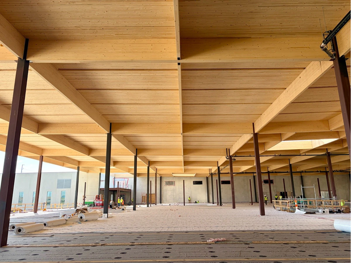 Exposed DLT panels and glulam framing above the Homemakers showroom floor