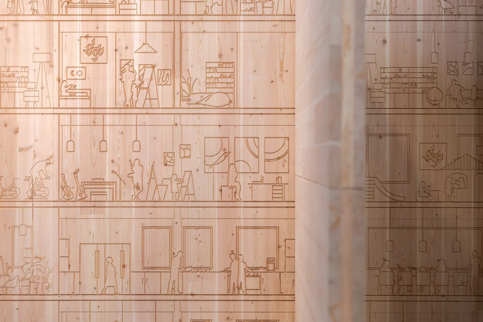 Rooms, furniture and people from Willow House carved into the pavilion’s Douglas fir CLT panels.