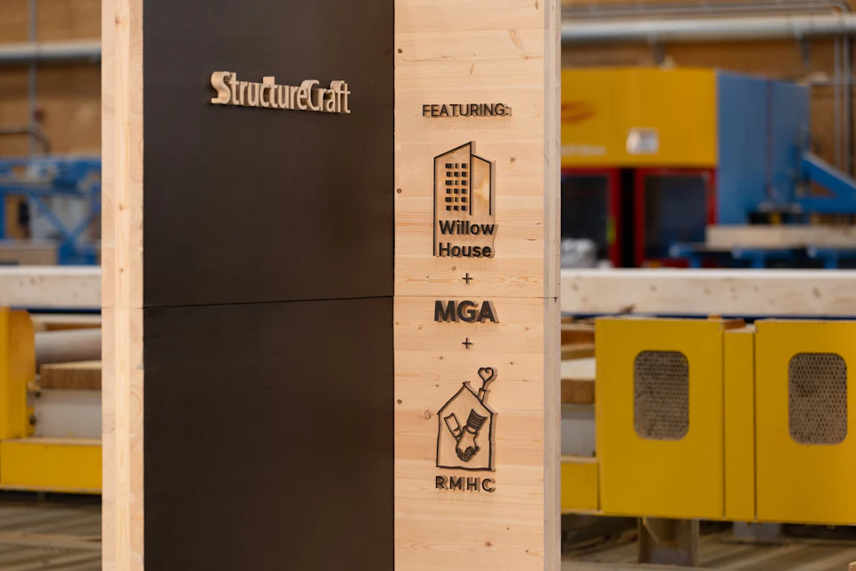 Willow House, MGA and Ronald McDonald House marks carved into the timber display.