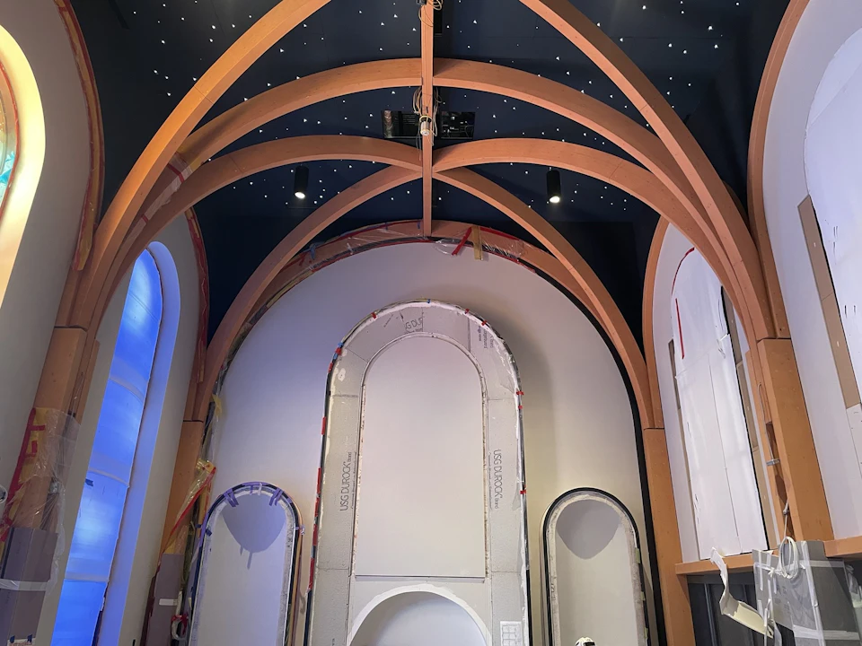 Intersecting timber arches above the chapel sanctuary