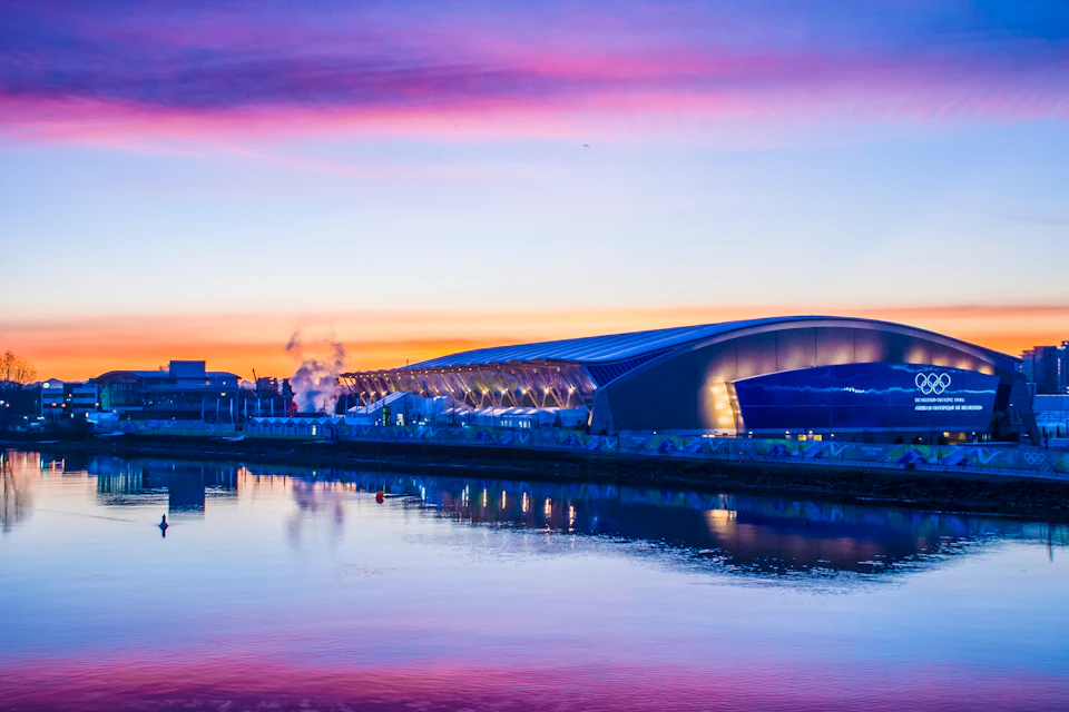 Richmond Olympic Oval reflected in the water at dusk