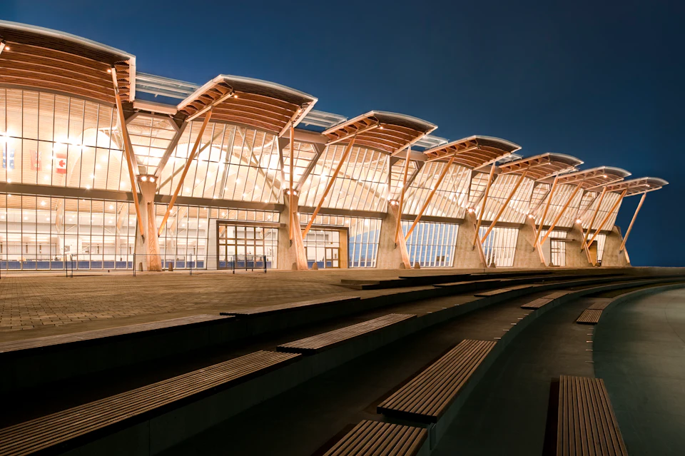 Richmond Olympic Oval exterior beside rail tracks at night