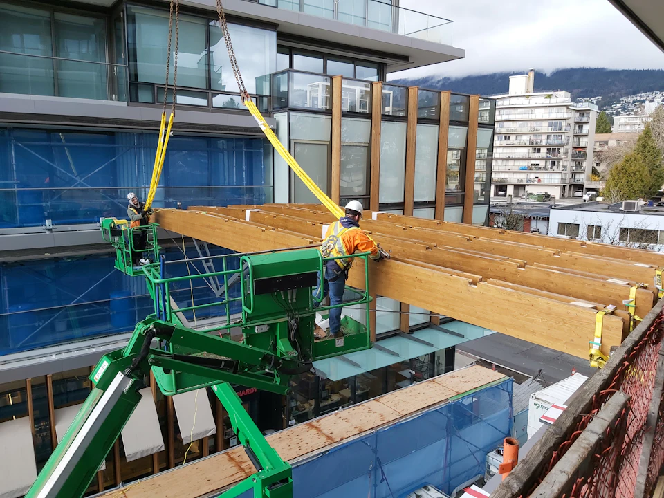 Workers installing beams at Ambleside Galleria