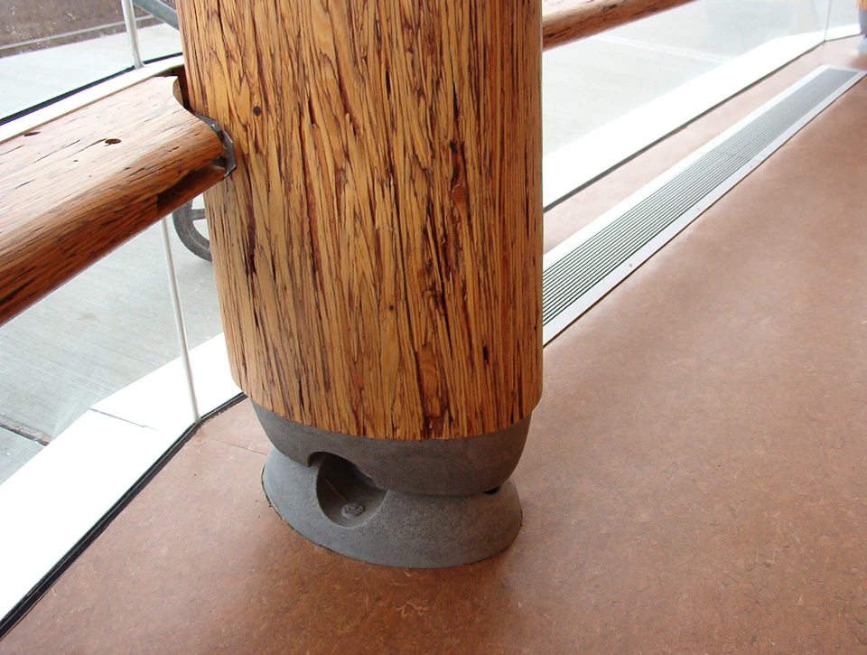 Round wood column base at Rix Centre for Ocean Discoveries