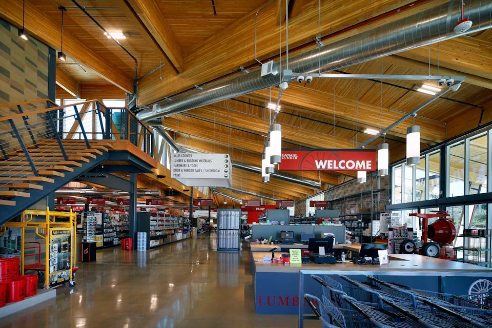 Retail interior beneath exposed timber at Ganahl Lumber Headquarters