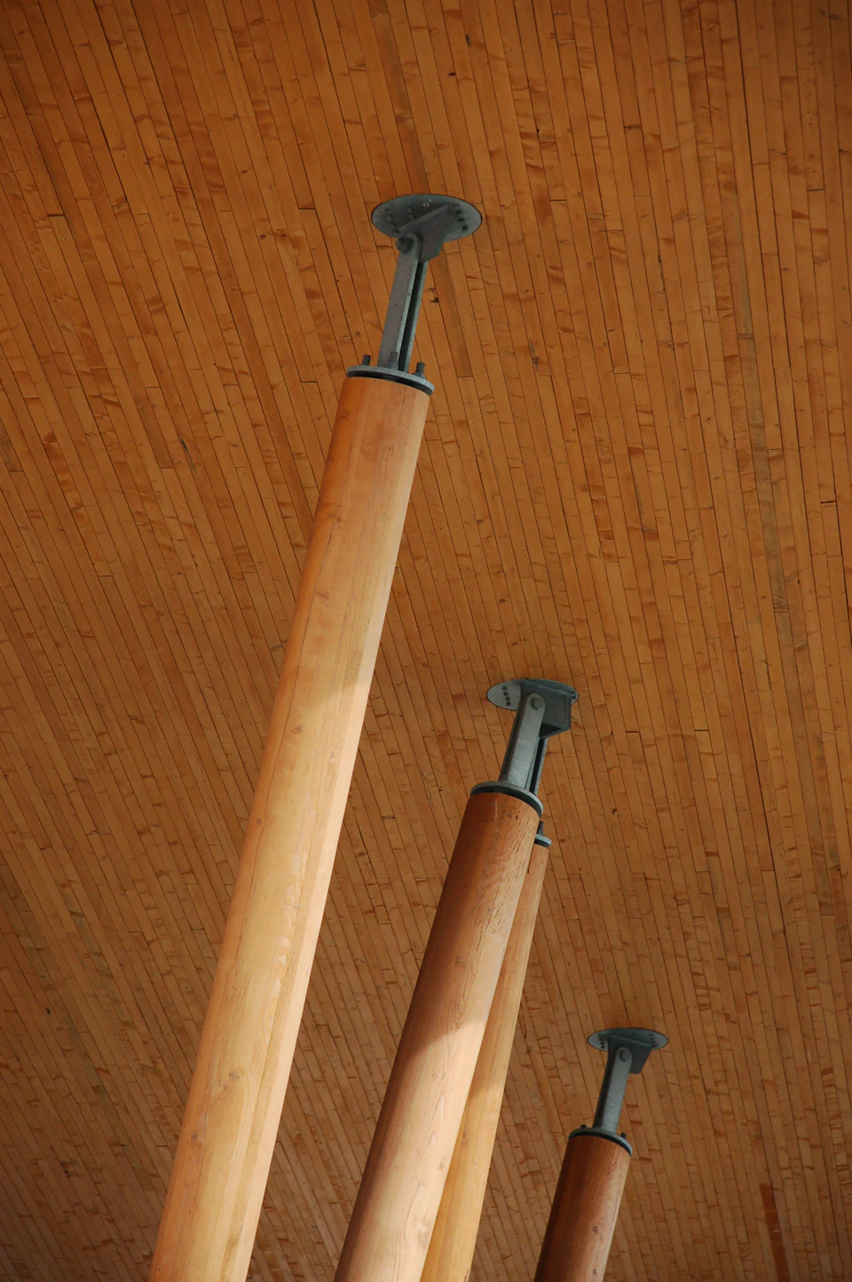 Round wood columns supporting the East Village canopy