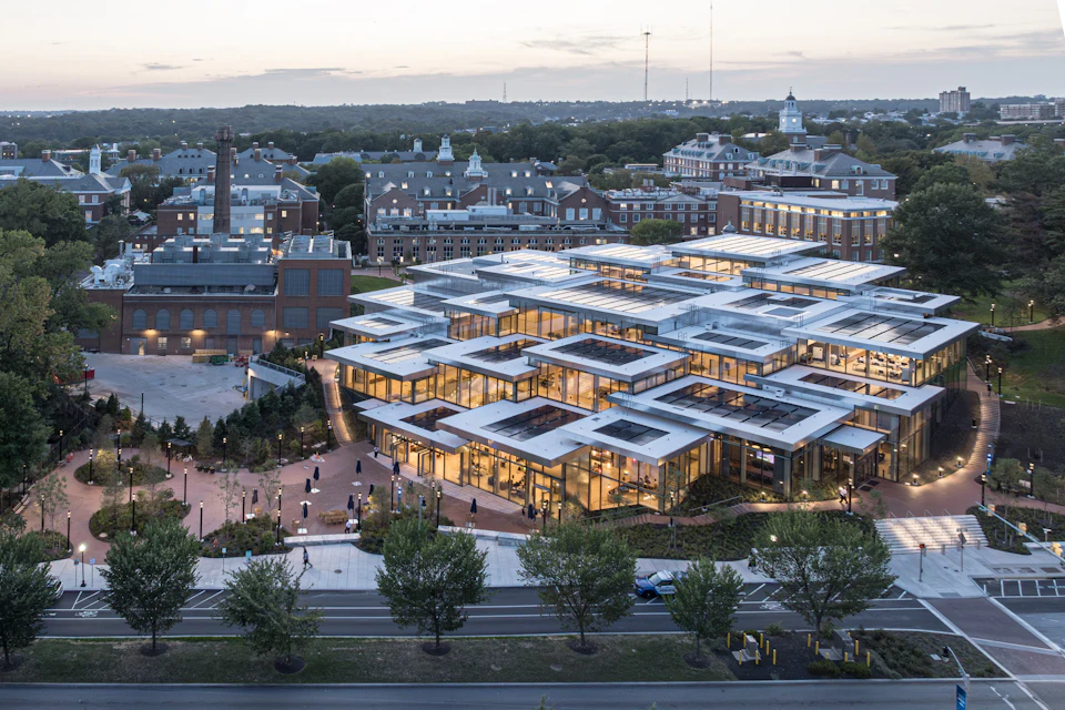 Aerial view of a low-rise complex arranged around courtyards