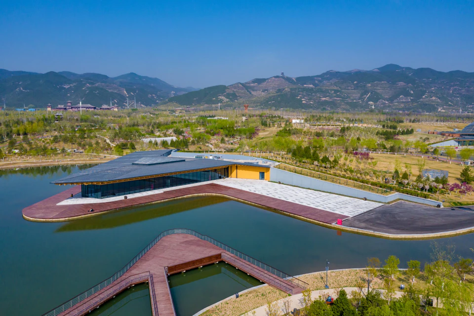 Aerial view of the Tea House extending across the lake