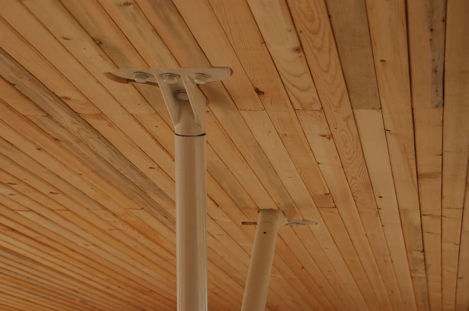 Steel connector between wood roof and column at Samuel Brighouse School atrium