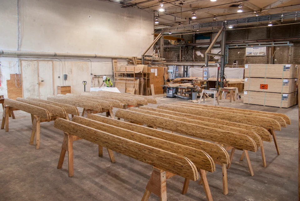 Curved wood entrance components in the fabrication shop