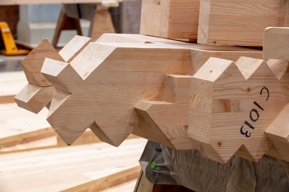 Interlocking saw-tooth timber connection before assembly.