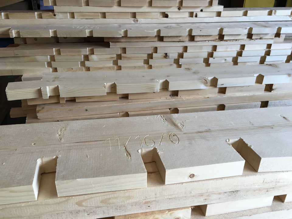 Stacked machined timber soffit components for Waiea Tower