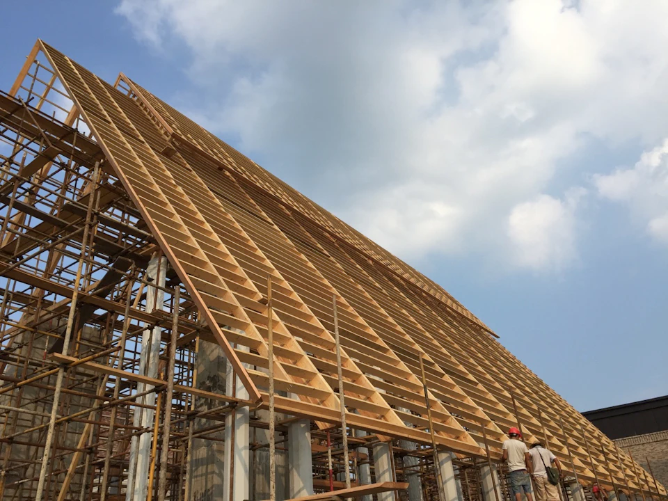 Steep wood roof under construction at Tongxiang Church