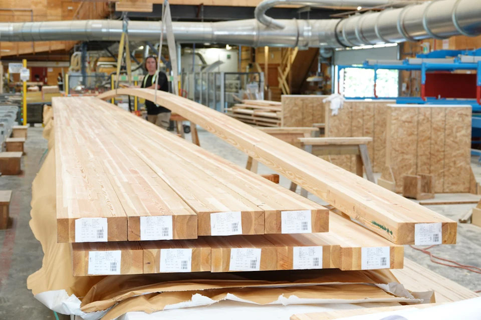 Stacked curved stair laminations in the fabrication shop