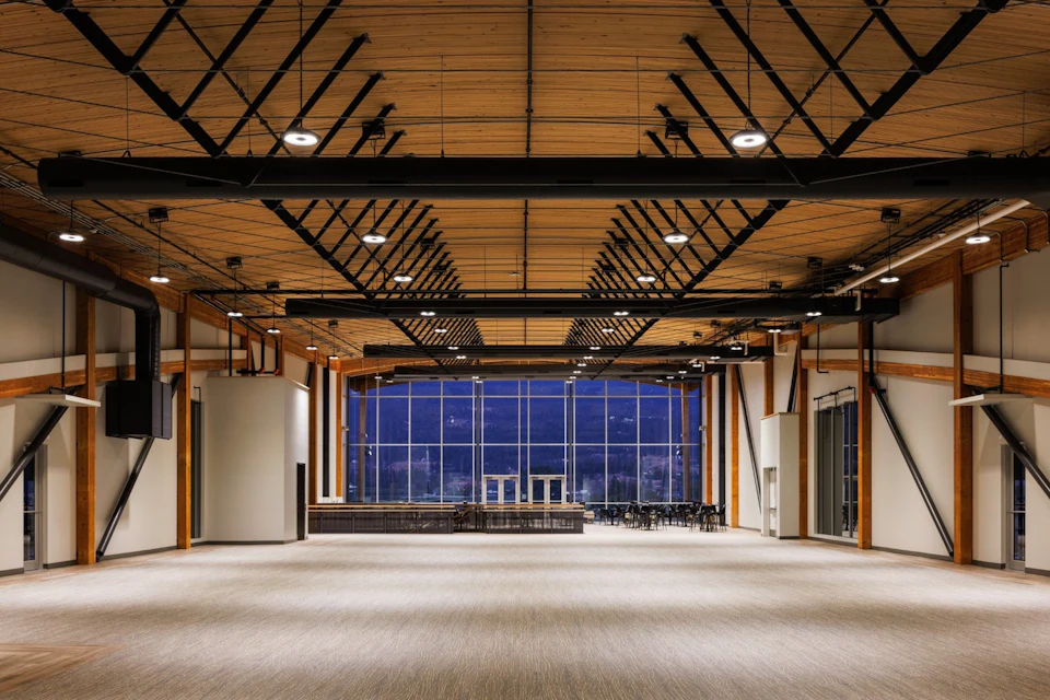Open interior beneath the wood ceiling at KF Aerospace Centre