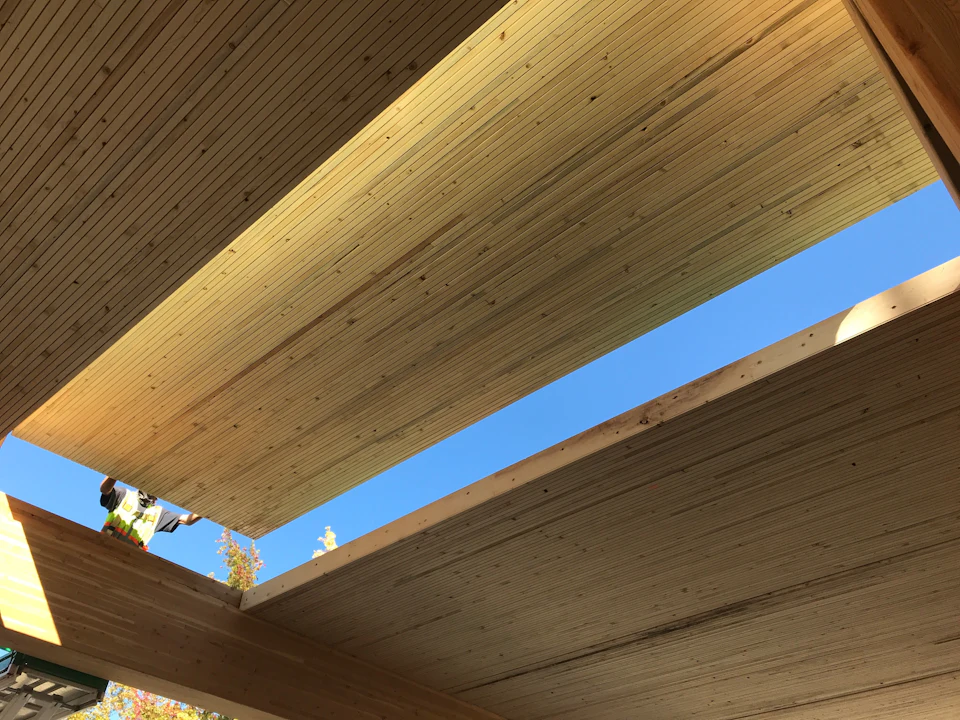 Wood floor panels viewed from below during installation at Lakeview Office Building