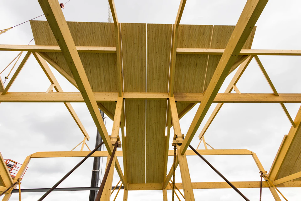 Wood floor panels and beams viewed from below during installation at Nashville Warehouse Company Office