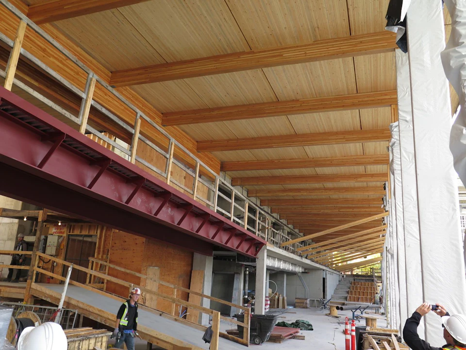 Wood roof framing under construction at UBC Orchard Commons