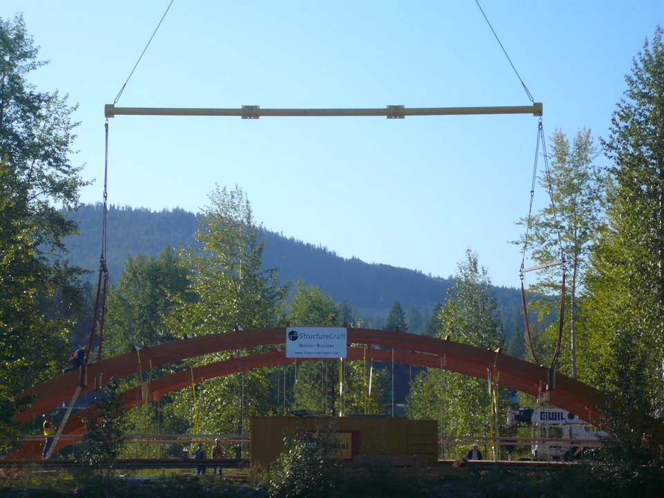 Bridge arch suspended during installation at Princeton Bridge of Dreams