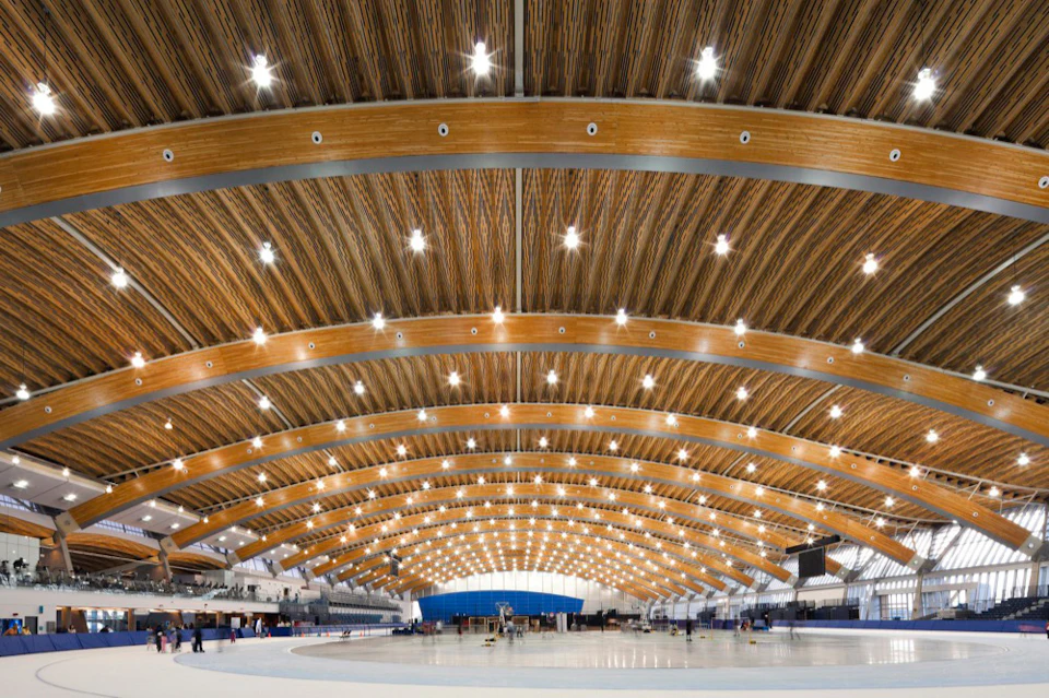 Wide ice rink interior beneath the Richmond Olympic Oval wood roof