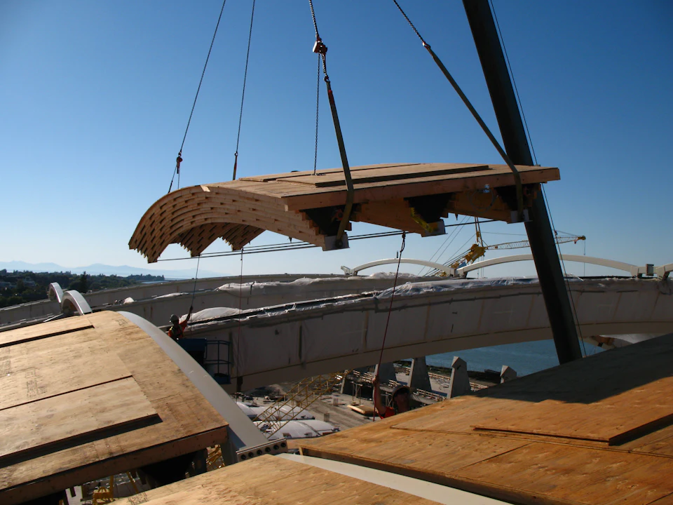 Curved roof panel suspended during installation at Richmond Olympic Oval
