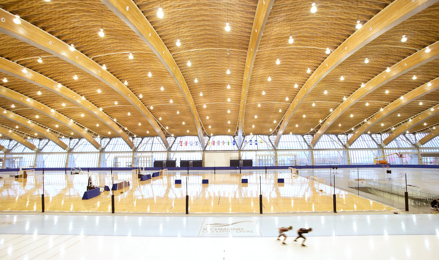 Ice rink beneath the curving wood roof at Richmond Olympic Oval