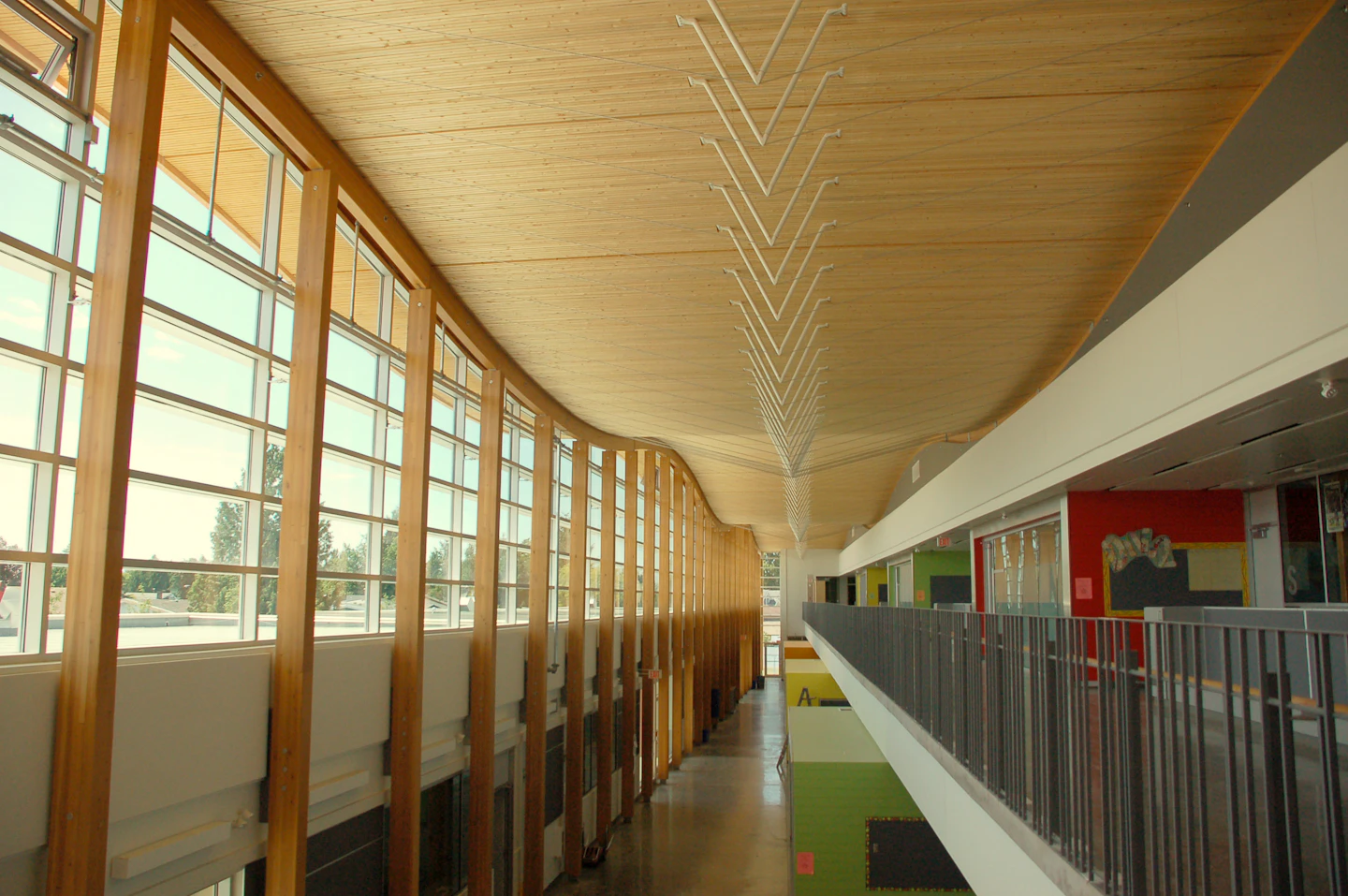 Wood-lined corridor at Samuel Brighouse School atrium