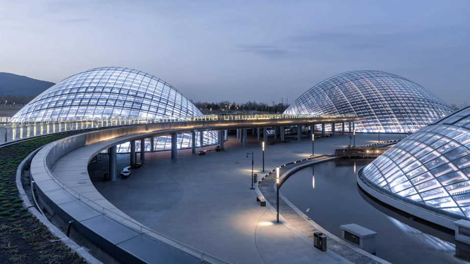 Bridge curving between Taiyuan Botanical Garden domes