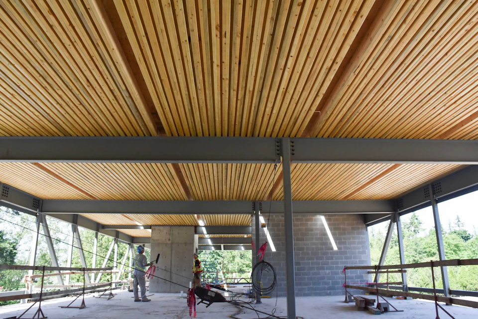 Open room beneath a wood slat ceiling at South Surrey Operations Center