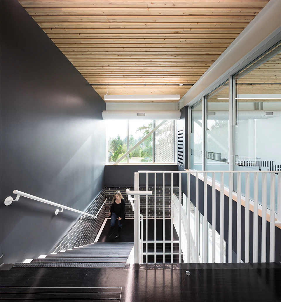 Stair beneath a wood ceiling at South Surrey Operations Center