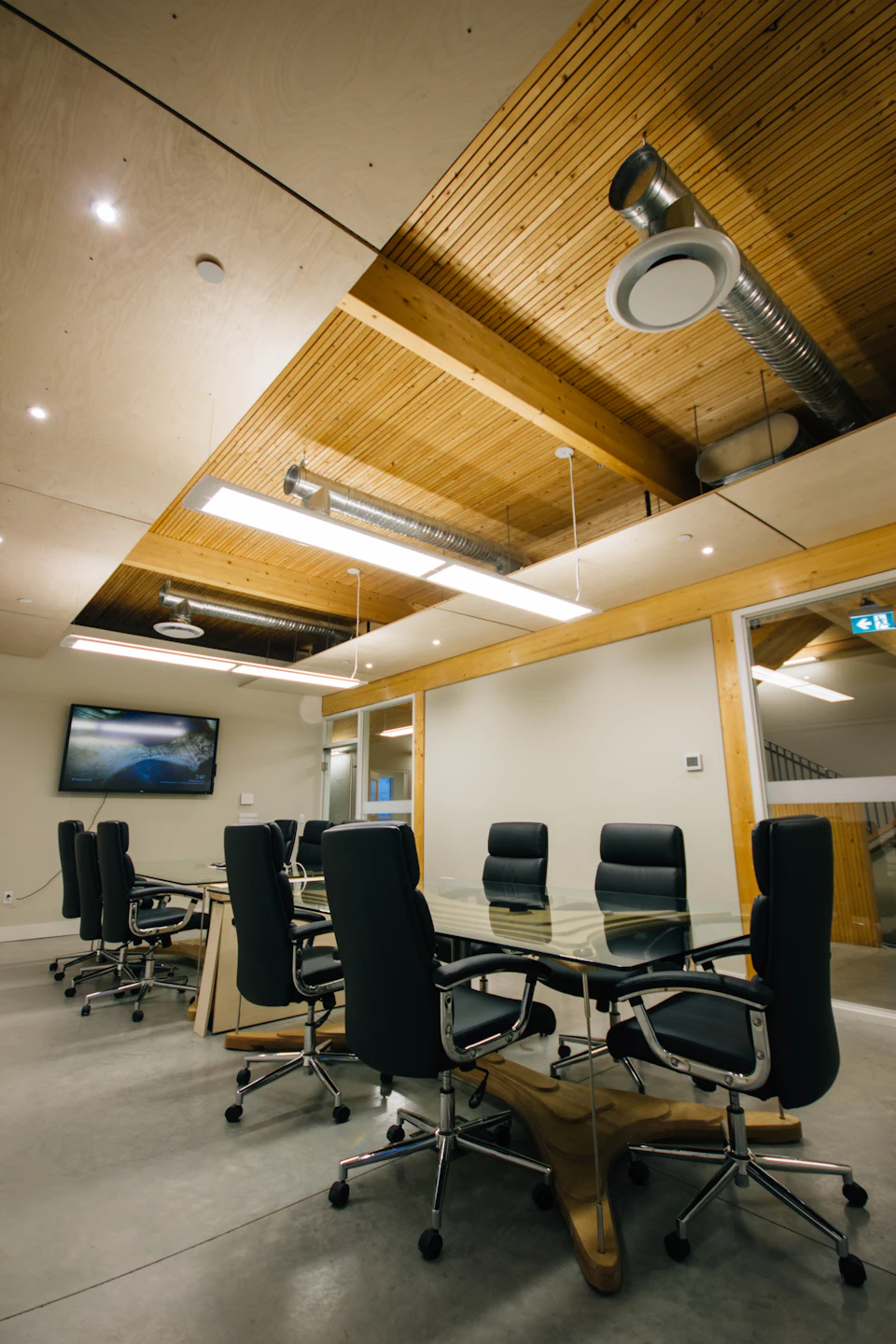 Meeting room beneath a wood ceiling at StructureCraft Headquarters