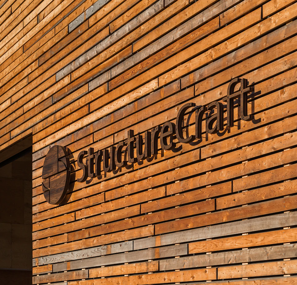 StructureCraft sign on wood exterior cladding