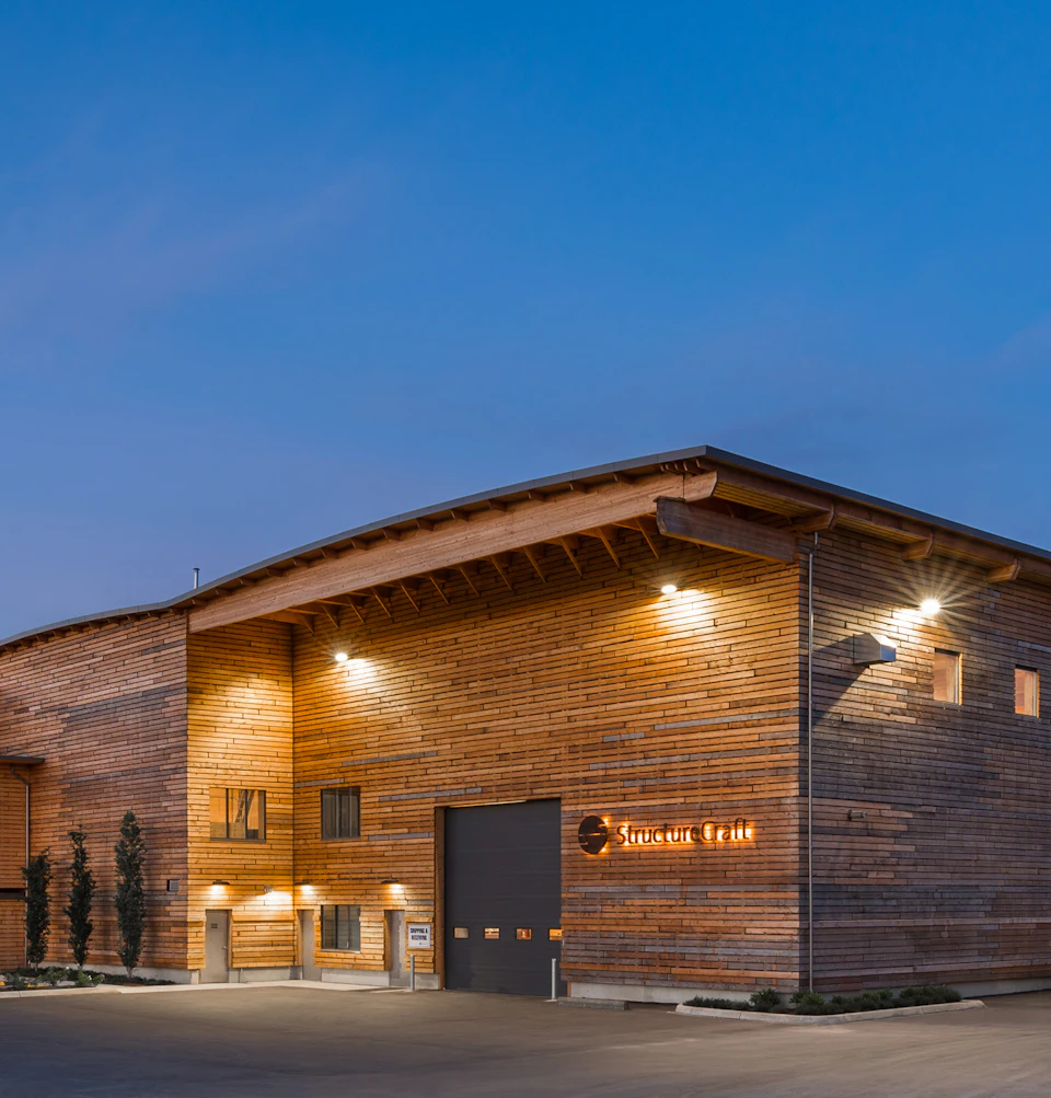 Fabrication shop exterior at StructureCraft Headquarters at night