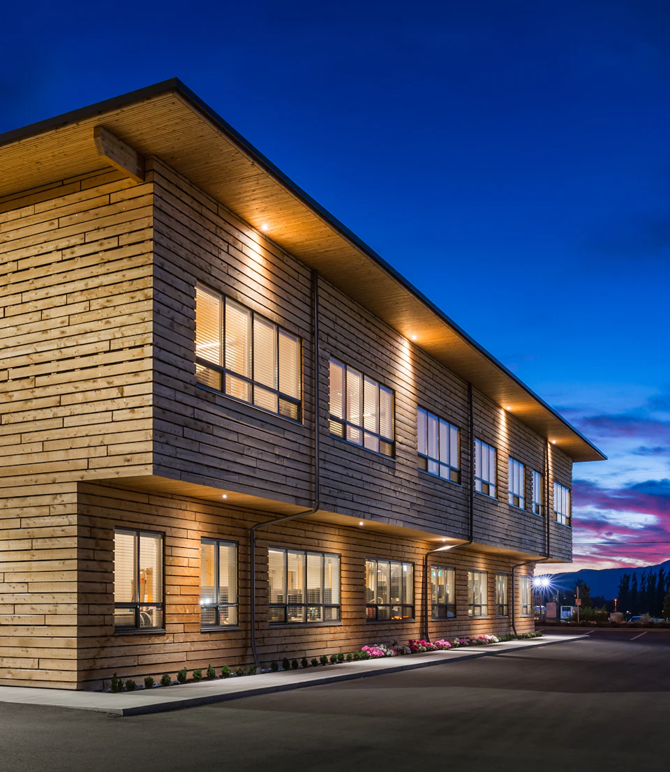 Office wing of StructureCraft Headquarters at dusk