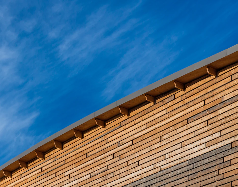 Wood cladding and roof edge at StructureCraft Headquarters