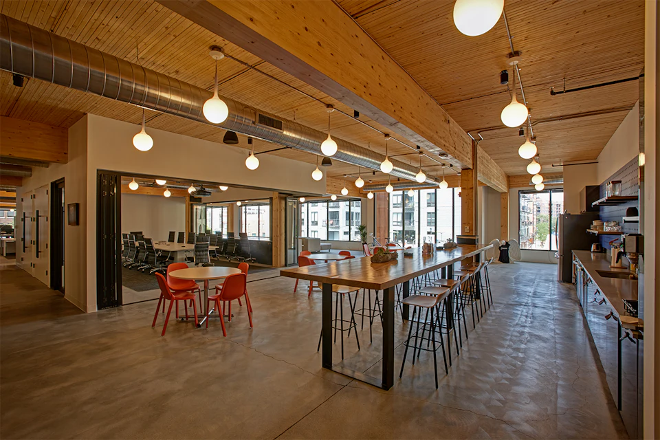 Office cafe beneath exposed wood at T3 Minneapolis