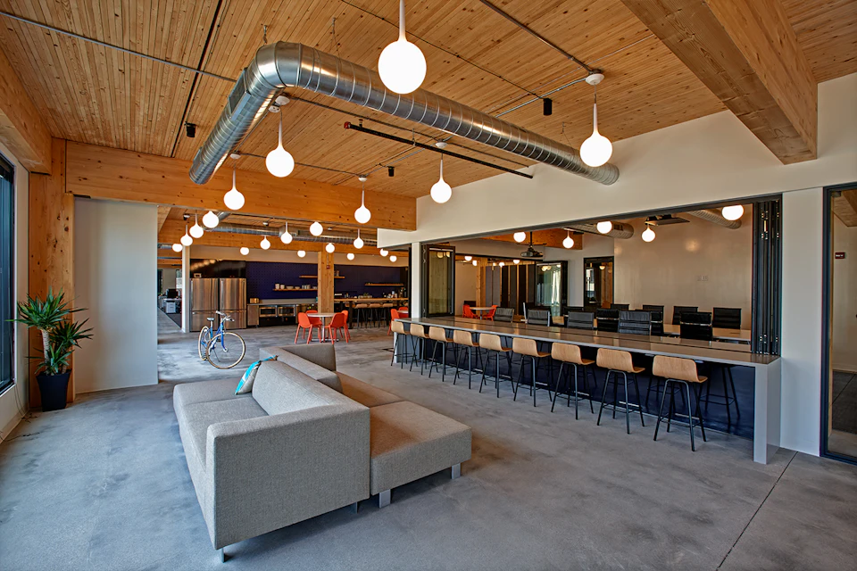 Office lounge beneath a wood ceiling at T3 Minneapolis