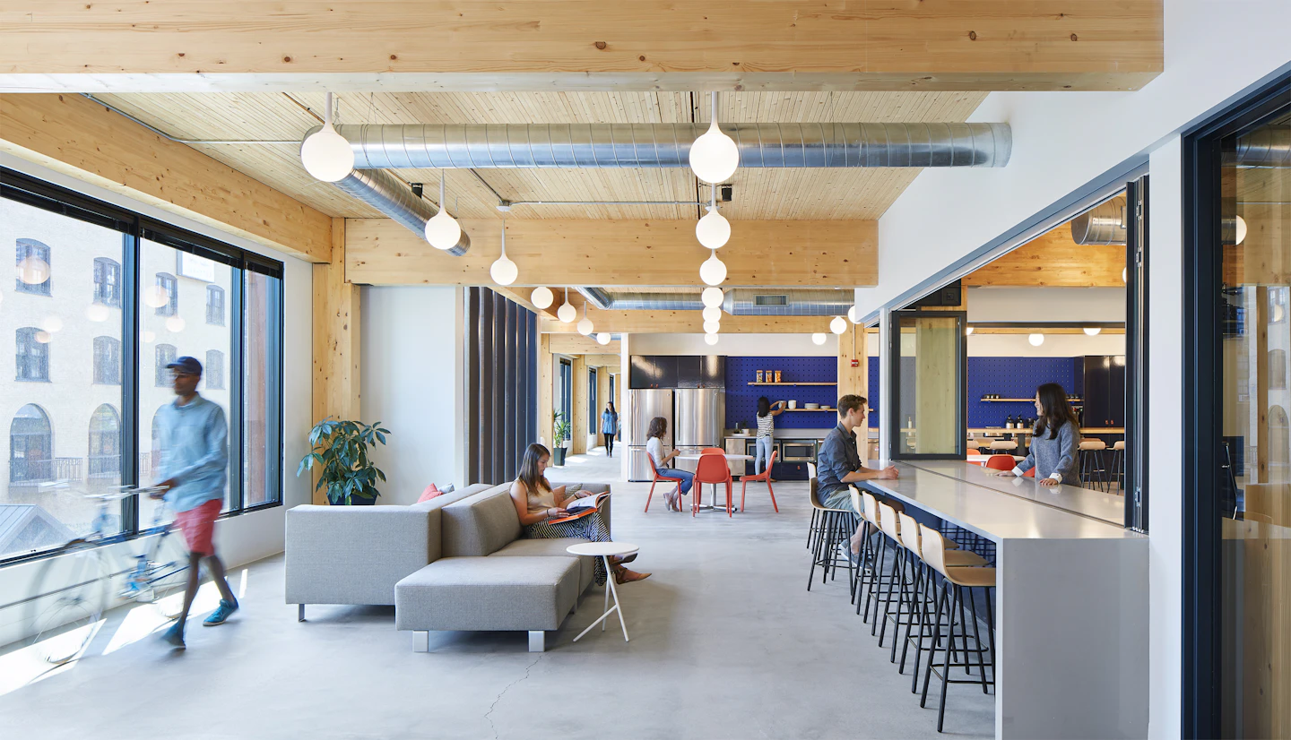 Office lounge beneath a wood ceiling at T3 Minneapolis