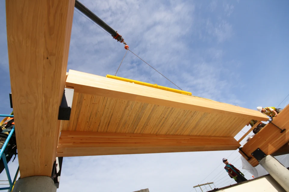Wood roof panel being positioned at Trail Appliances Headquarters