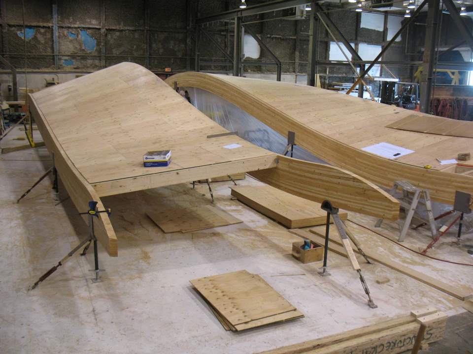 Curved wood roof panels in the fabrication shop for VanDusen Botanical Gardens Visitor Centre