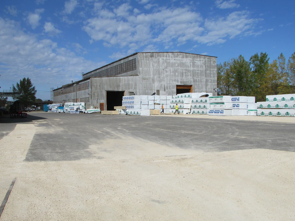 Wrapped building components outside a fabrication shop for T3 Minneapolis